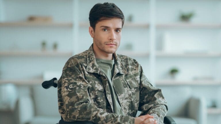 a disabled veteran in a wheelchair, in his fatigues.